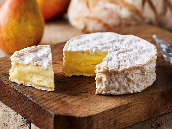 Cheese on a wooden chopping board