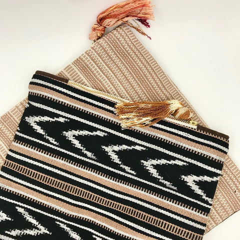 Thread Spun hires resettled refugees to make womens accessories in San Diego, California, using textiles from developing countries.