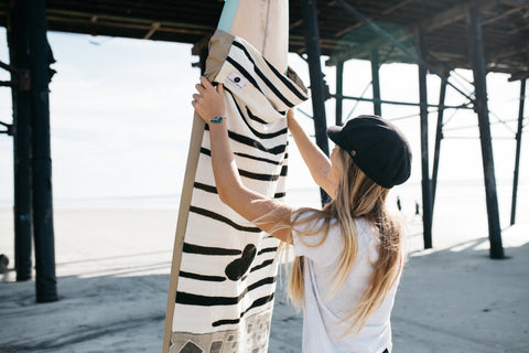 Handmade surfboard bag by Thread Spun featuring artisan and fair trade textiles from Mali.