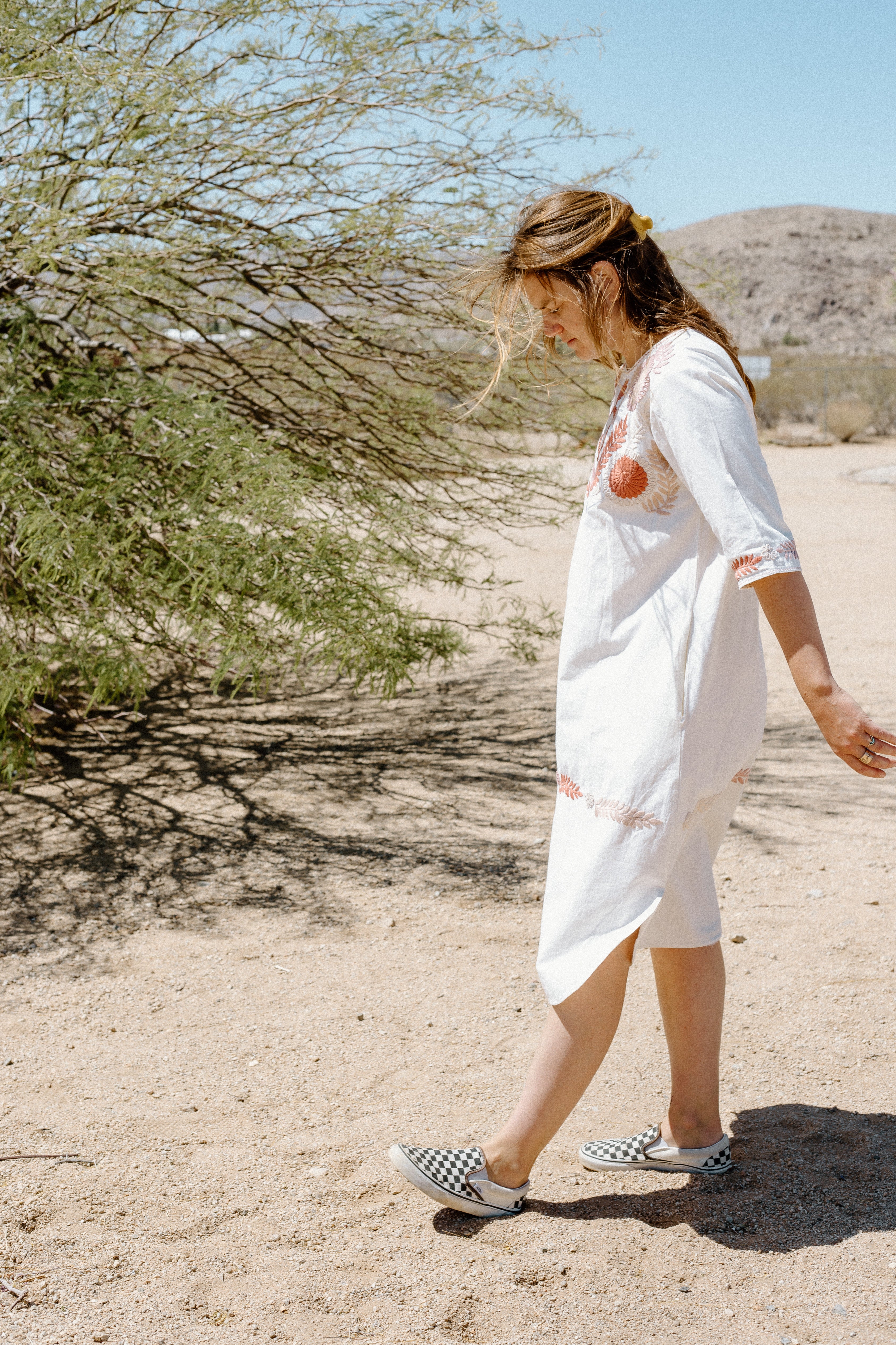 Woman wears handmade caftan in Joshua Tree 