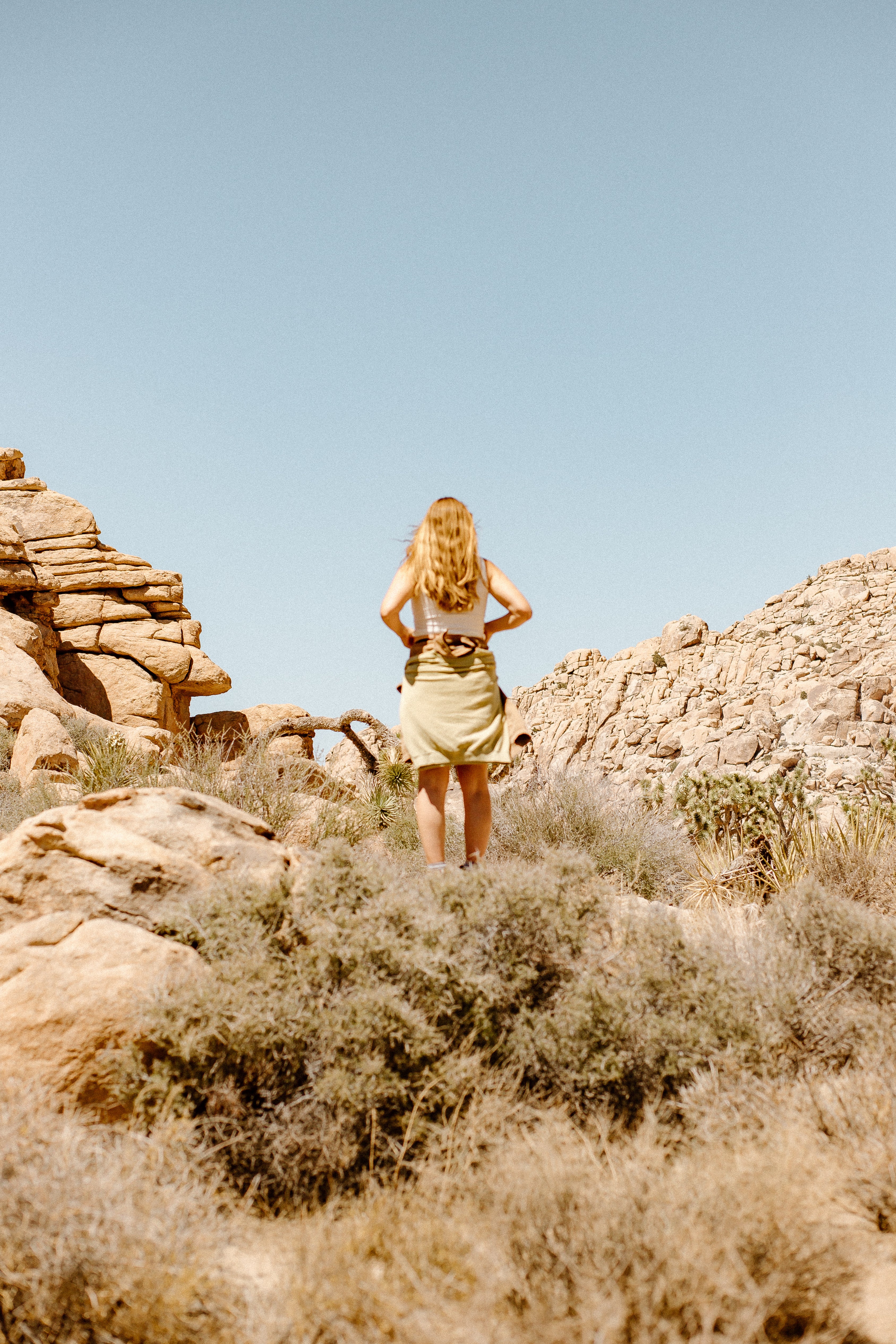 Owner of Thread Spun sustainable boutique in Joshua Tree standing in Jungmaven hemp clothing