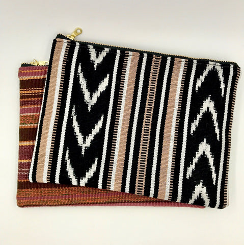 Zippered pouches handsewn by resettled refugees in San Diego using handwoven textiles by Thread Spun.