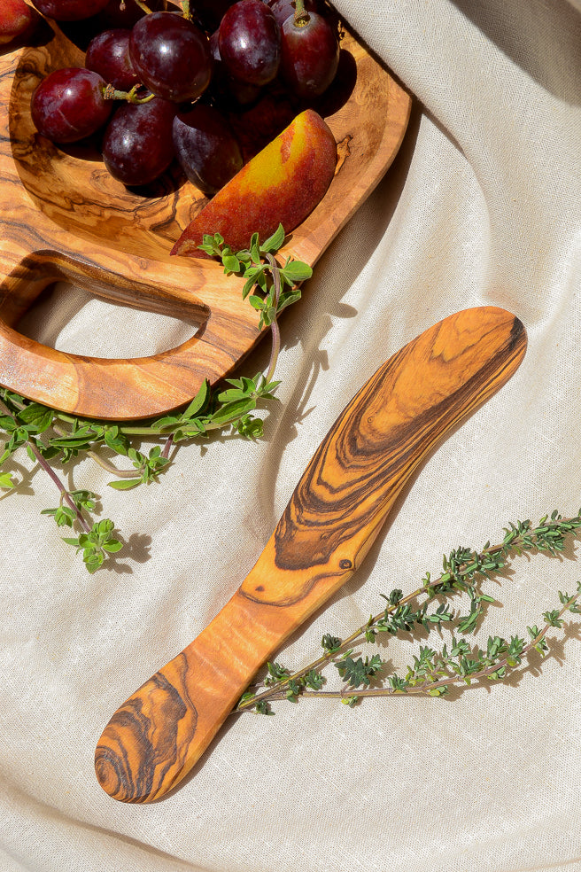 Made by hand in Tunisia with olive trees that had finished producing olives. A great tool for slicing soft cheese and can also be used as a spreader for butter, jams and jellies.