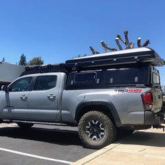 3rd gen Tacoma long bed with RLD stainless steel truck cap and iKamper roof top tent on Pinsu rack