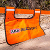 Orange ARB recovery damper shown on snatch strap during off road vehicle recovery