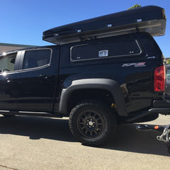 Chevy Colorado Bison AEV Diesel Truck with iKamper Skycamp installed on truck topper ARE bars