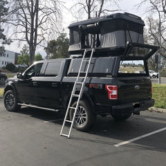 black Ford F-150 with RLD Stainless Steel Canopy installed James Baroud Roof Top Tent