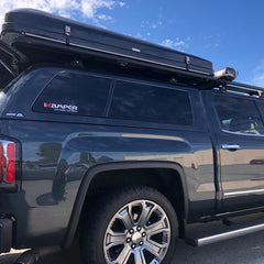 gmc denali 1500 pickup with dual pioneer platforms, batwing 270 awning, road shower and ikamper installed at california overland outfitter