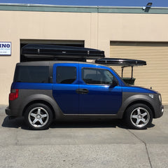 blue Honda Element with black iKamper Roof Top Tent installed on Thule crossbars in San Francisco, CA