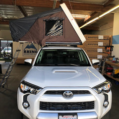 white 5th gen Toyota 4runner with Rhino Rack Pioneer Platform and roof top tent installed in California