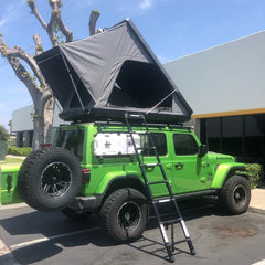 Green Jeep JLU with DeeZee Rack System and Camp King Aluminum Roof Top Tent