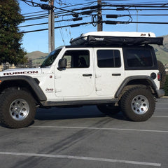 White Jeep JLU with James Baroud Space Roof Top Tent and Rhino-Rack Compact Batwing Awning Installed