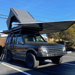Land Rover Discovery with Camp King RTT and RLD GhostAwn 360 Awning
