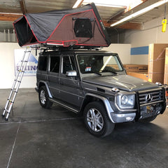 Mercedes G-Wagon with Rocky Black Line-X iKamper Skycamp Roof Top Tent installed on Rhino-Rack Roof Racks