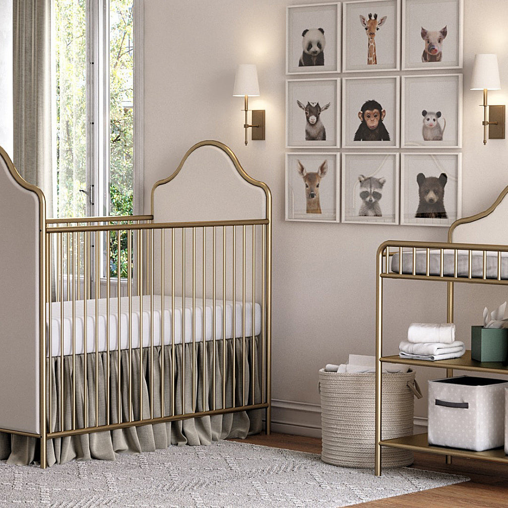 Nursery room with crib and gallery wall of baby animal prints