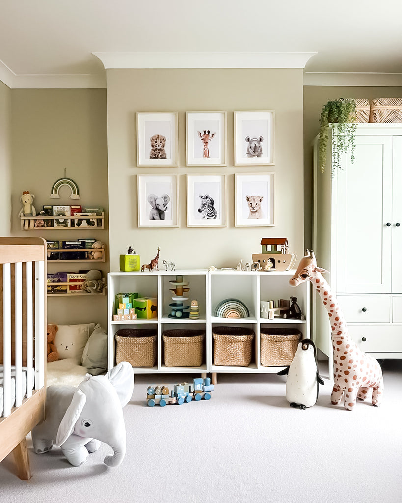 Nursery room with storage, baby animal prints, crib