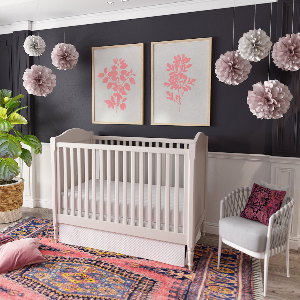 Nursery room with deep navy walls and a pink rug, pink botanical artwork on wall