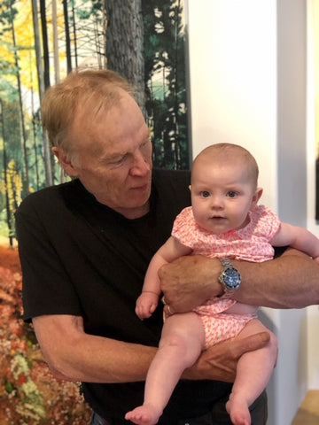 Artist Peter Gough with his granddaughter
