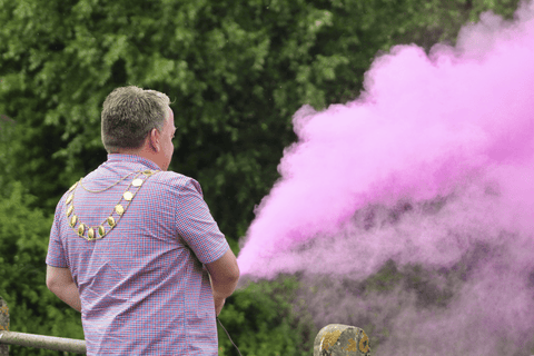 Man with pink colour fountain