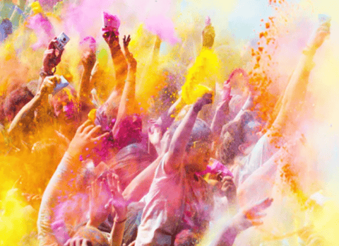 Colour powder cloud covering people