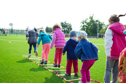 Kids walking over obstacles