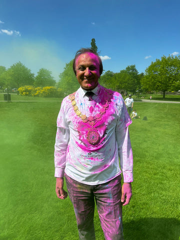 man covered in colour powder