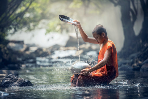 Monk in a river