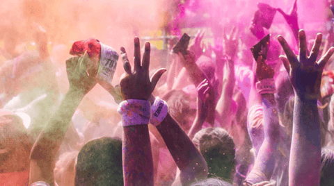 People covered in colour powder