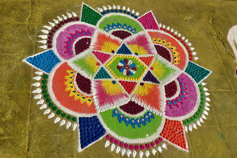 Flower Rangoli art design created using vibrant colours