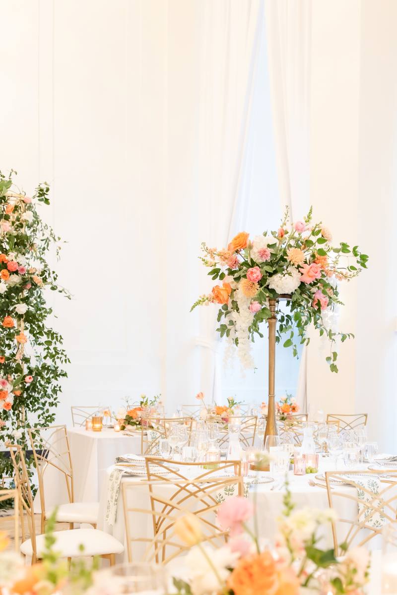 Stacy K Floral | Arbor Midtown Wedding with raised floral centerpieces on round tables.