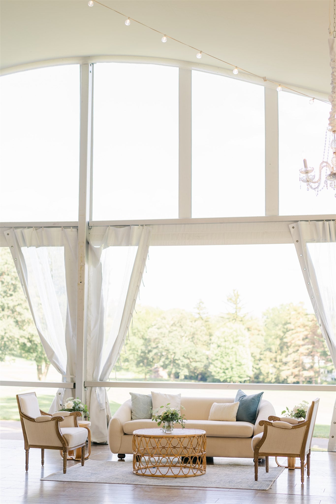 lounge seating area with floral centerpieces