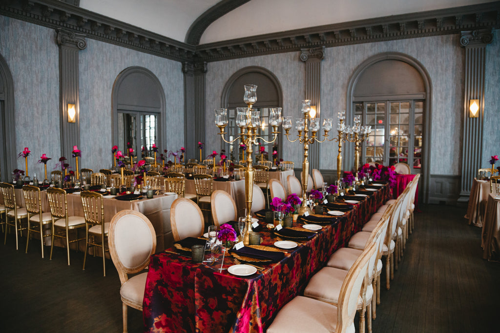 overall view of long guest tables with candelabras