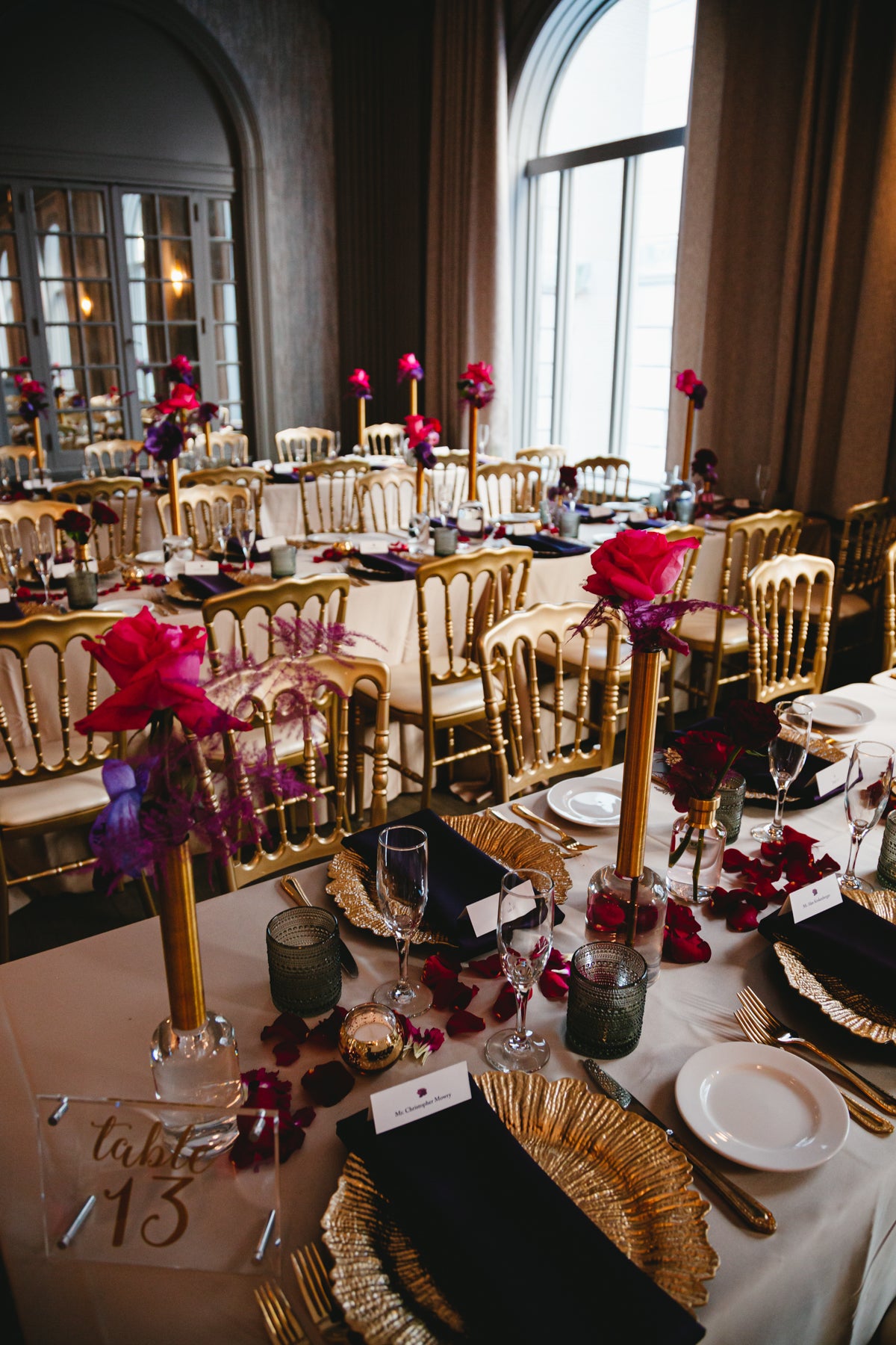 gold charger with red roses in bud vases