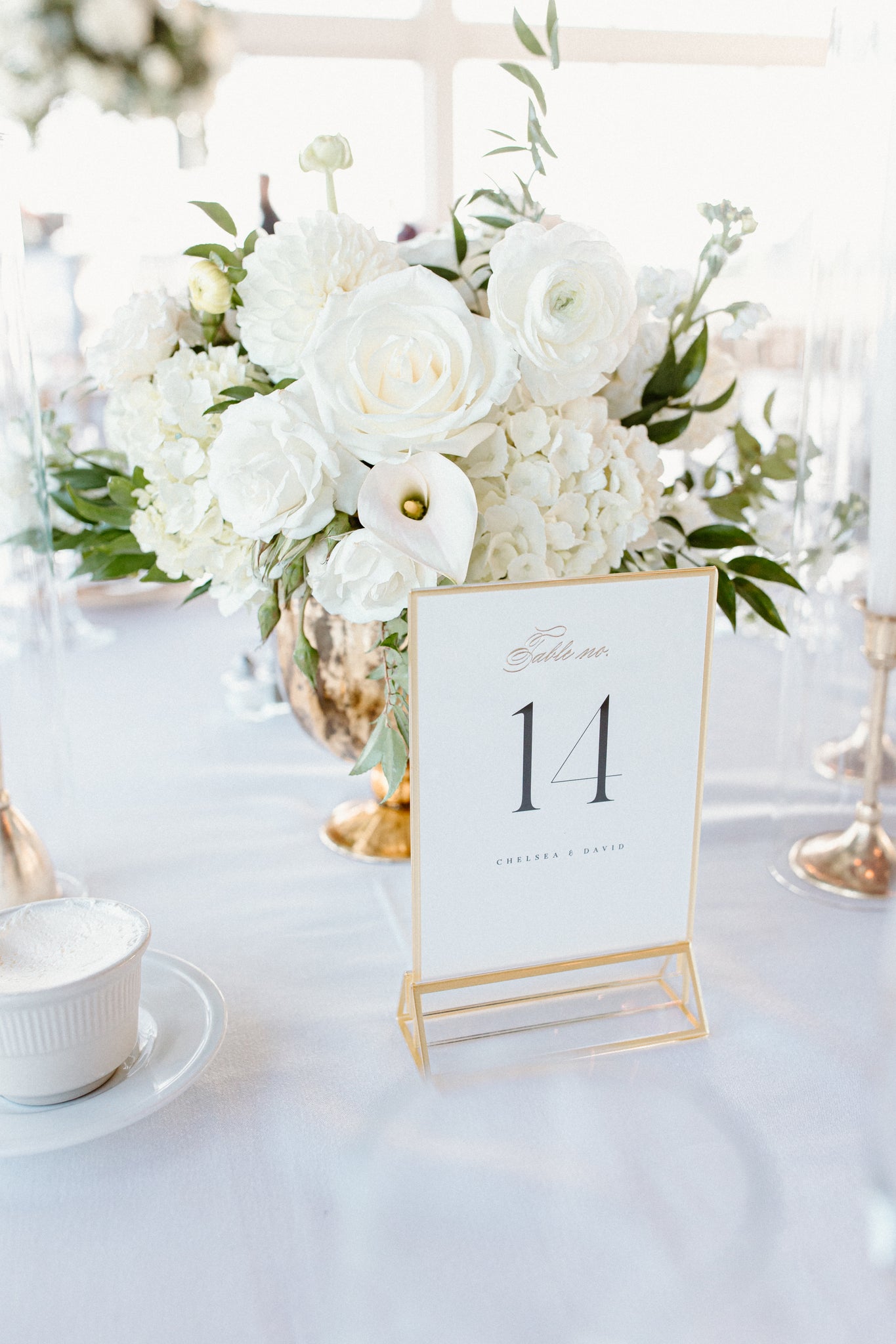 closeup of white short centerpiece with table number