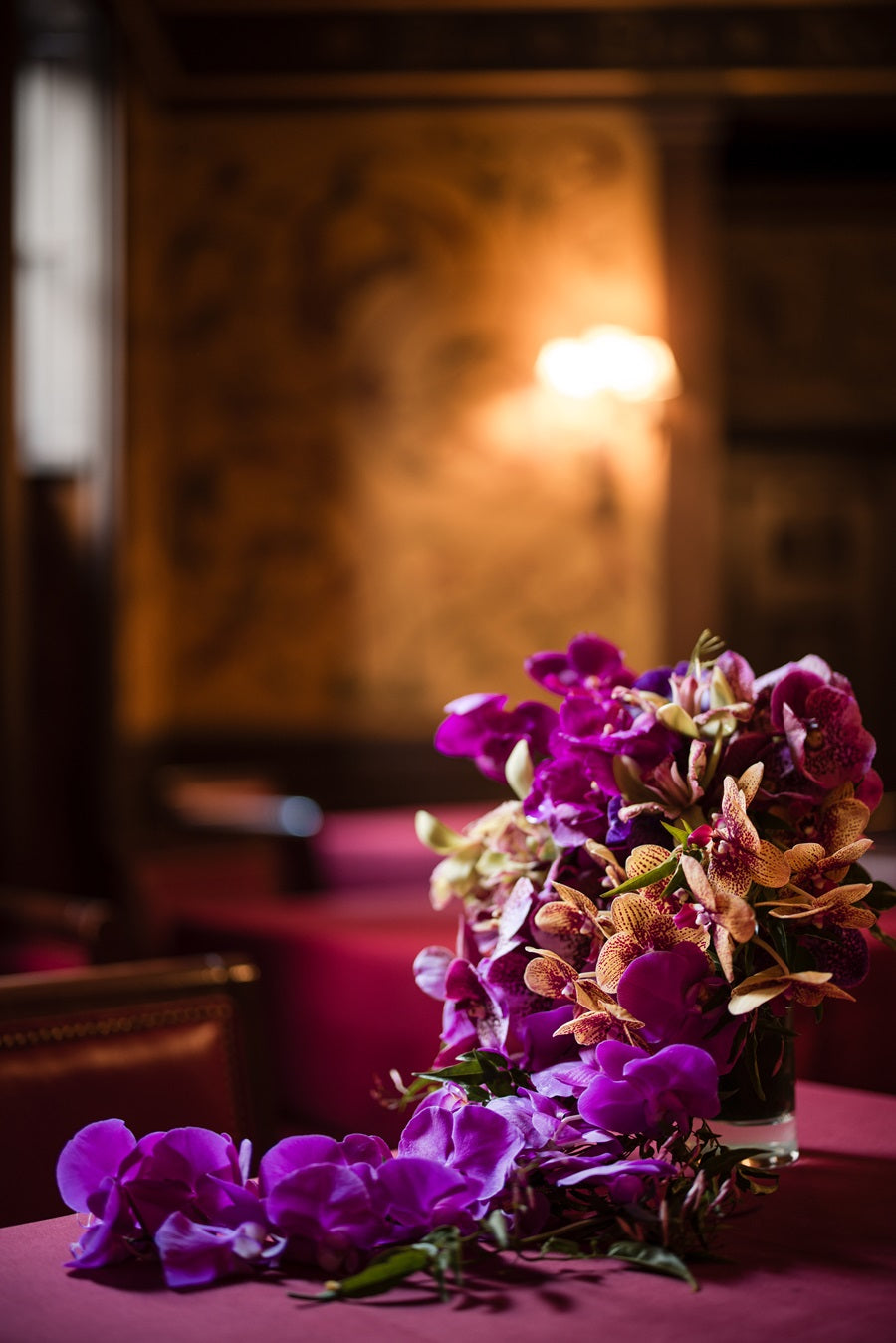 The bridal bouquet full of draping orchids in pink, purple, and peach.