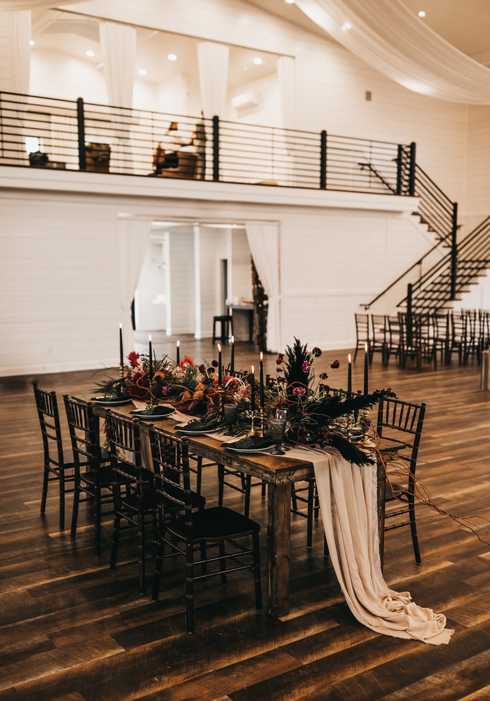 full view of farm table with floral centerpieces 