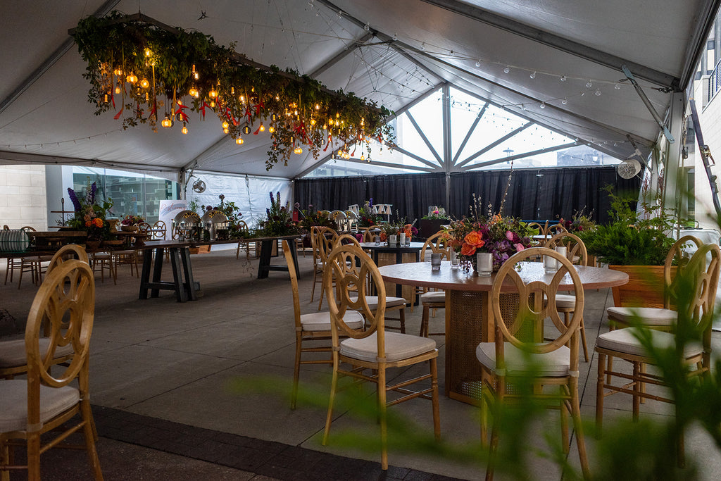 round guest table with colorful flower centerpiece 