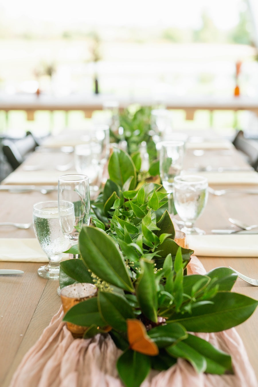 Table photo featuring the greenery running down the center.