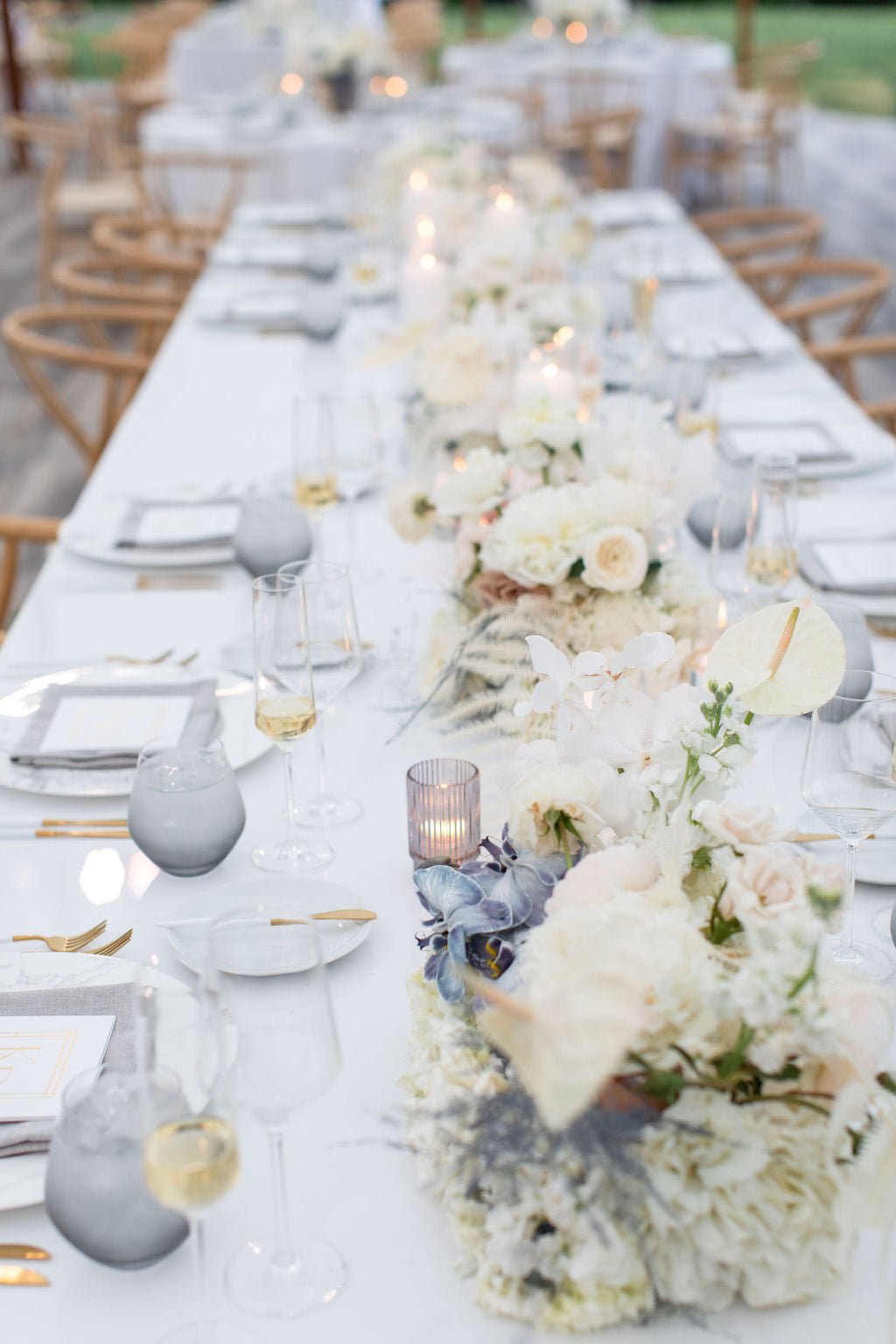 long tablescape with multiple white centerpieces