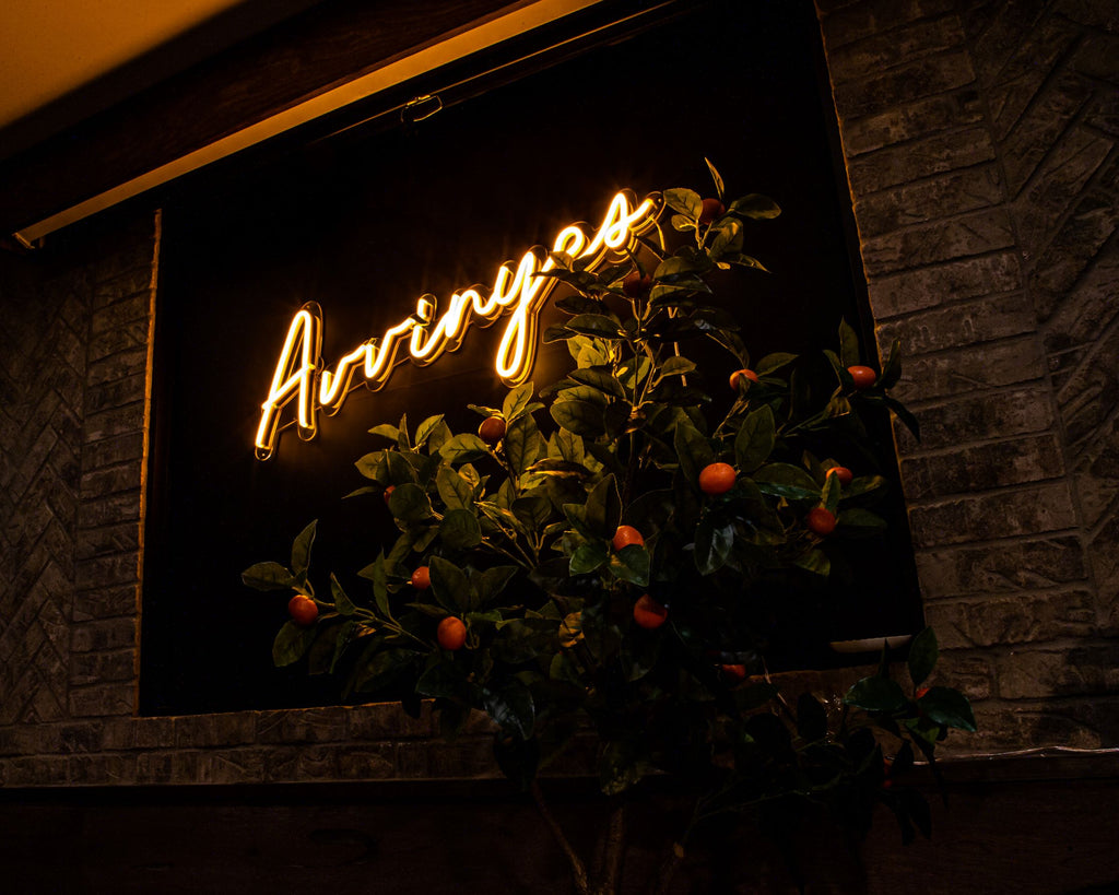 neon sign with orange tree