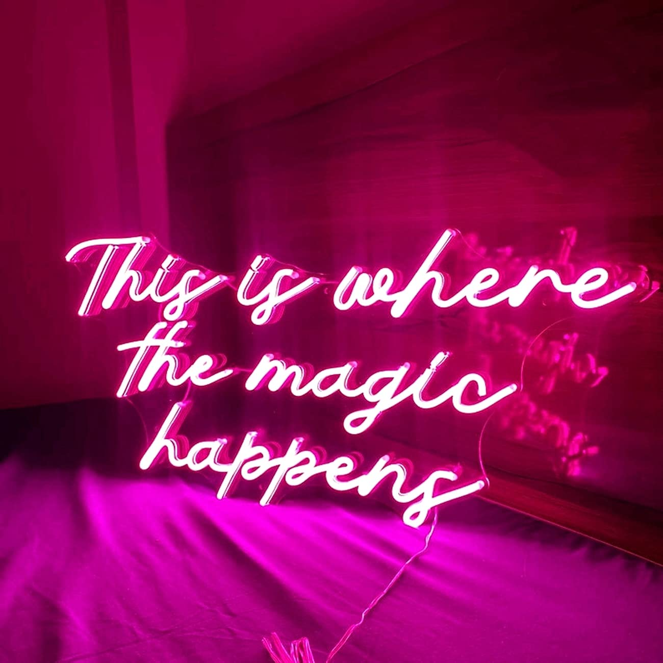 "This is Where Magic Happens" neon sign