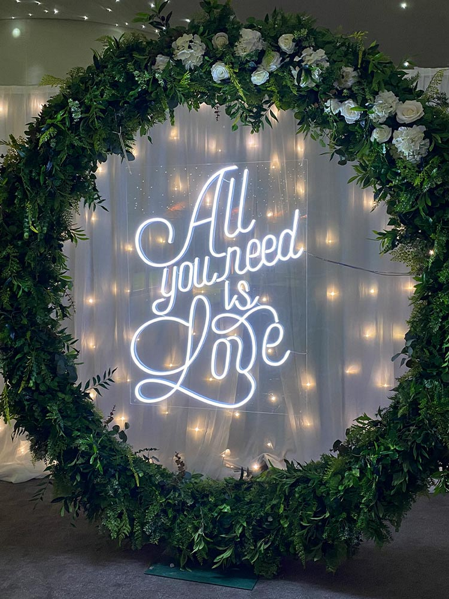 the "All You Need Is Love" neon sign