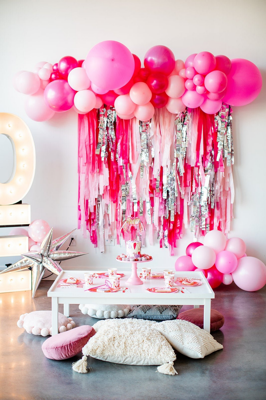 Backdrop with colorful balloons, cascading ribbons