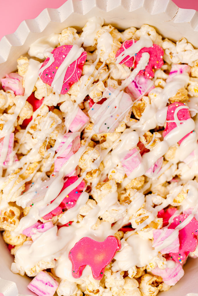 Cotton Candy Marshmallows, Frosted Animal Crackers, popcorn, white chocolate melted/drizzled on top
