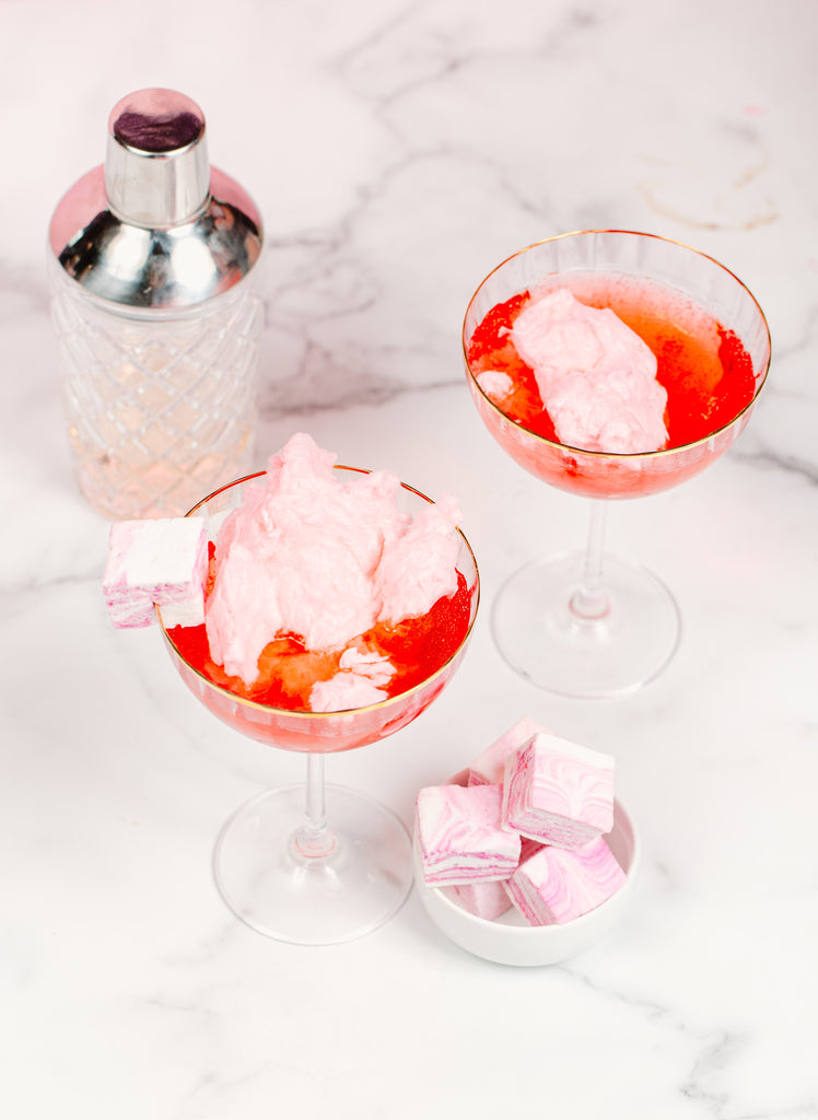 As the cotton candy melts into the cocktail, it turns from pink to a bright blood orange. Add XO marshmallow cotton candy marshmallows to the rim as garnish