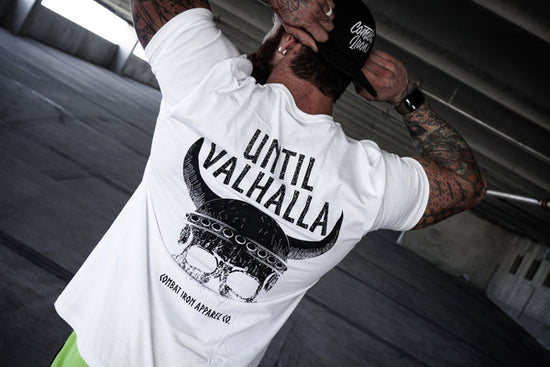 Man showing off veteran designed Until Valhalla T-shirt