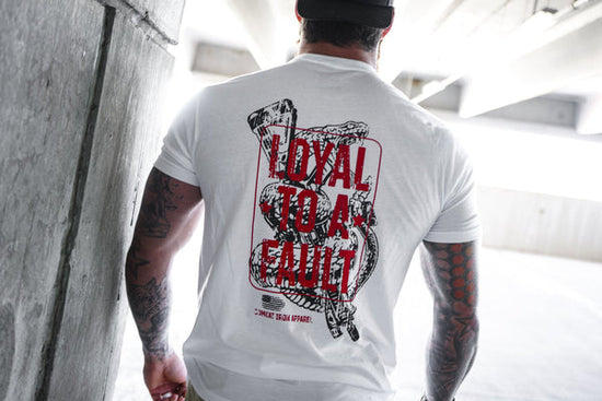 tattooed athlete with white patriotic t-shirt 