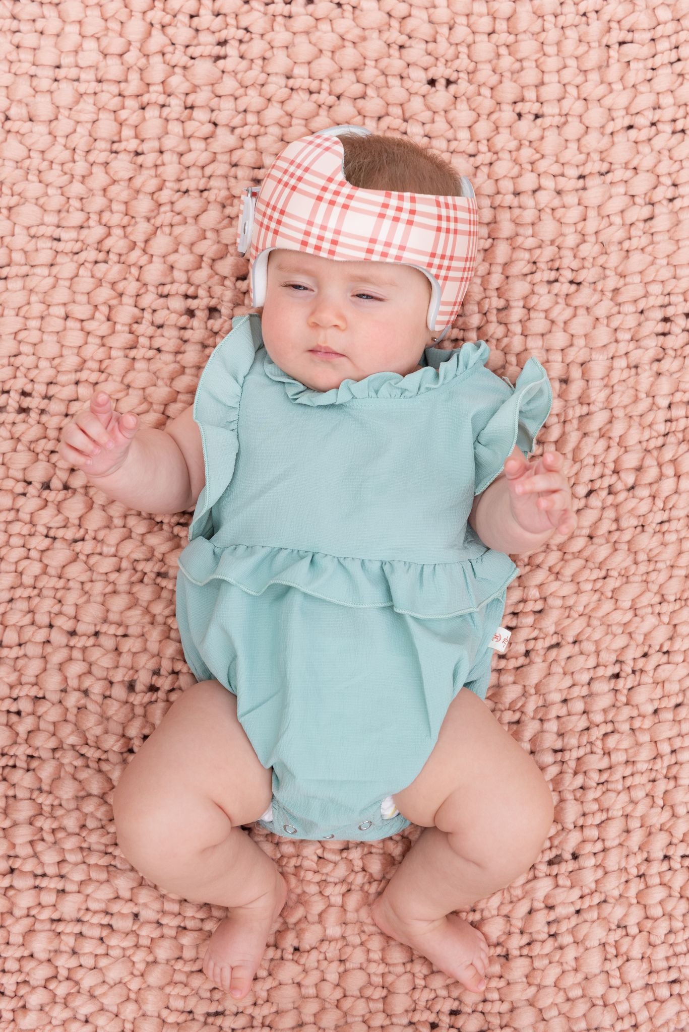 hazel-in-helmet-on-blanket