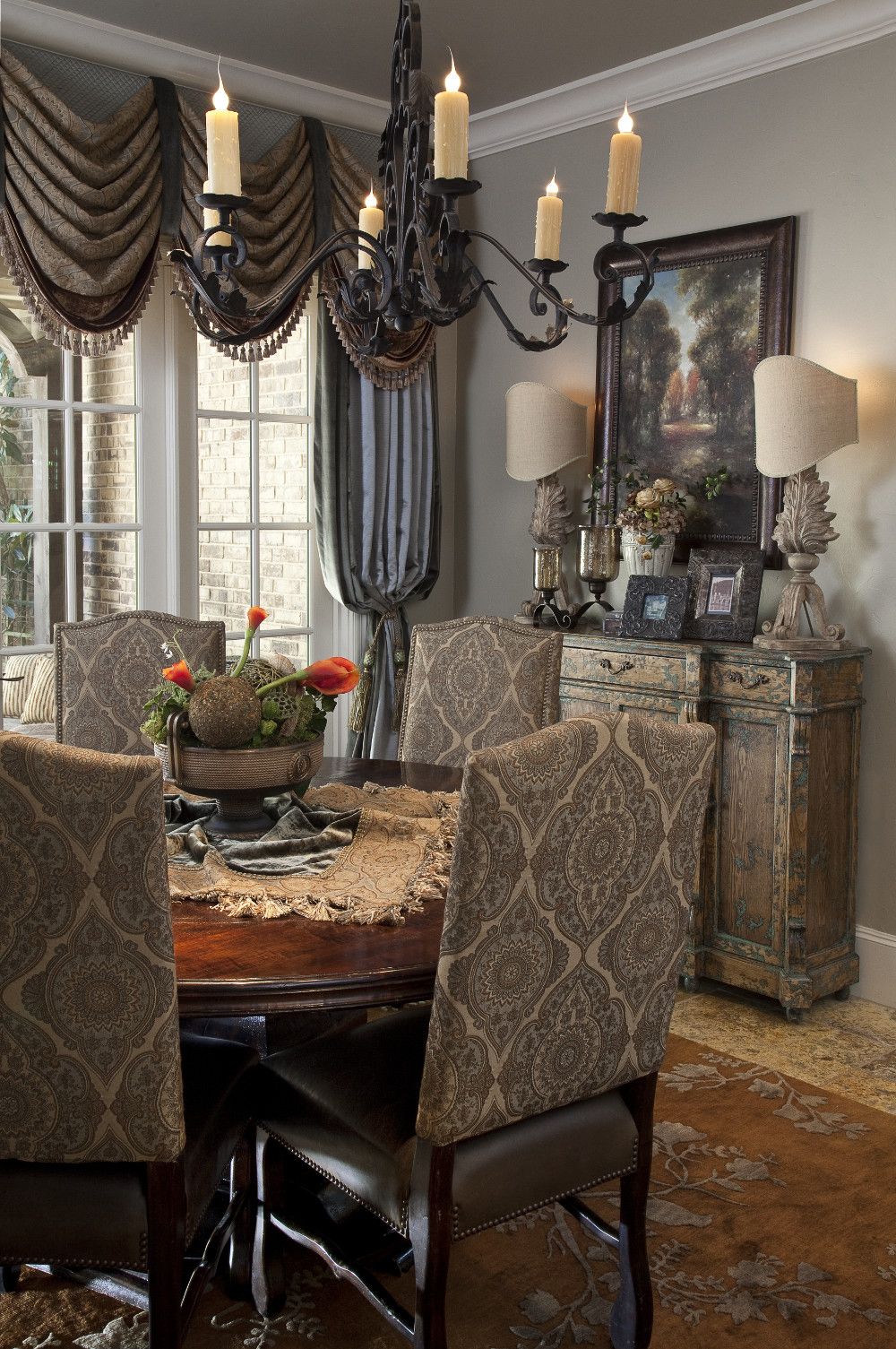 classic drapery in a traditional dining room with wrought iron chandelier