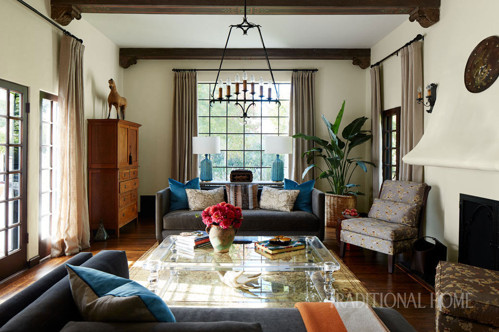 traditional interior with wrought iron curtain finishes and chandelier